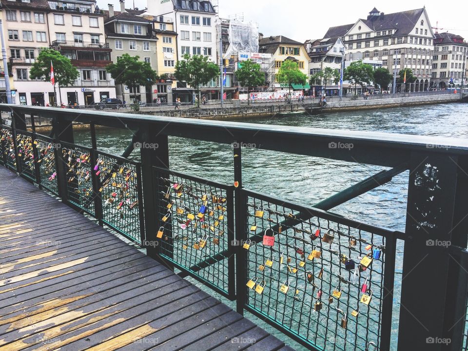 Padlocks attached to a fence