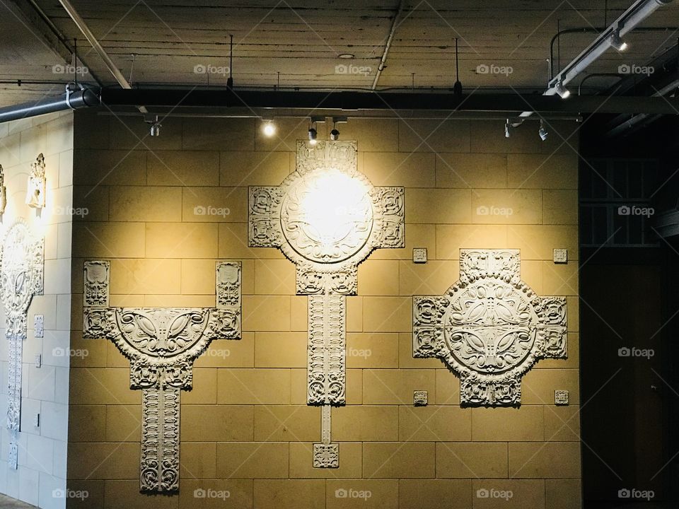 A very nice display of white wall art on a tile wall with incredible lighting in St. Louis at The City Museum. 