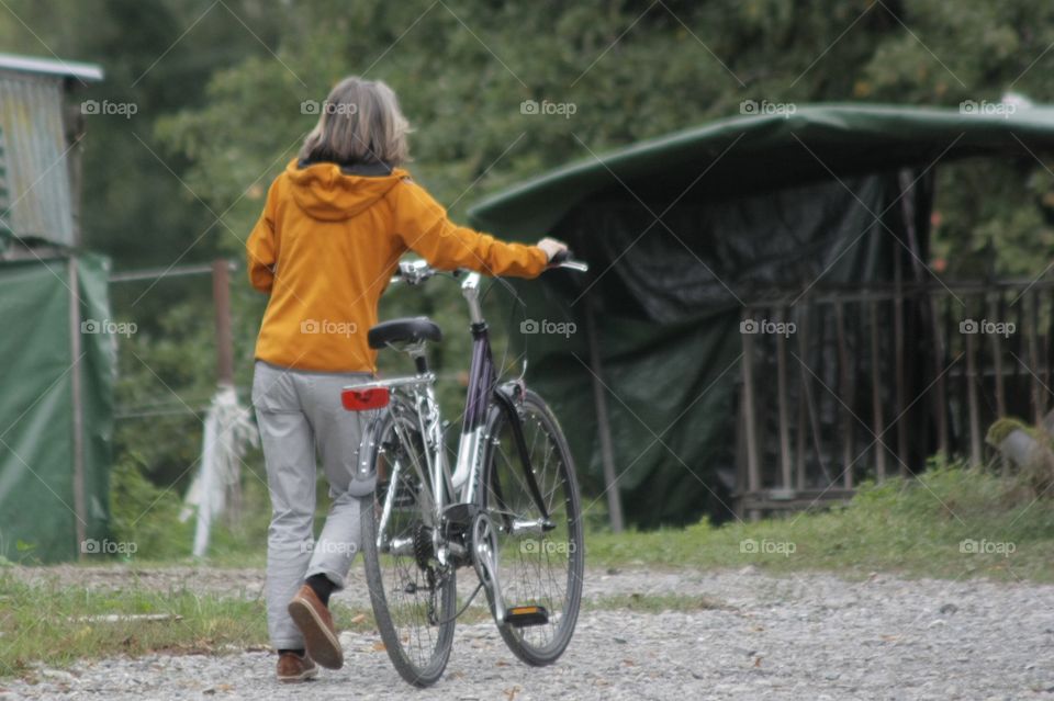 Woman Walking With Bicycle. Woman Walking With Bicycle