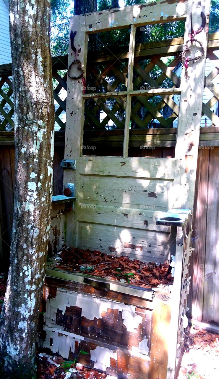 old door repurposed as coat rack and bench  now I am going to put it in the garden for decor