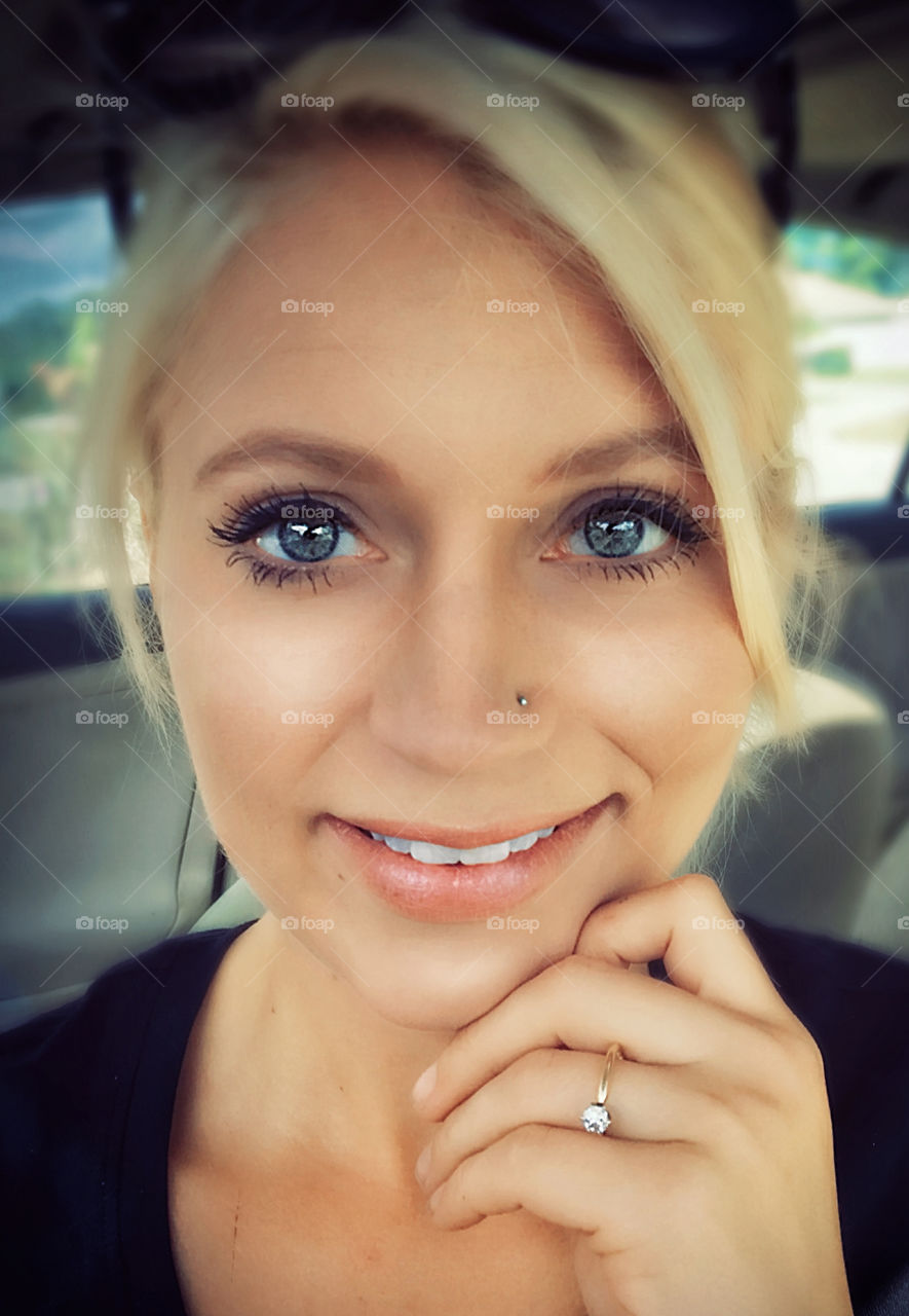 Blonde woman in a car