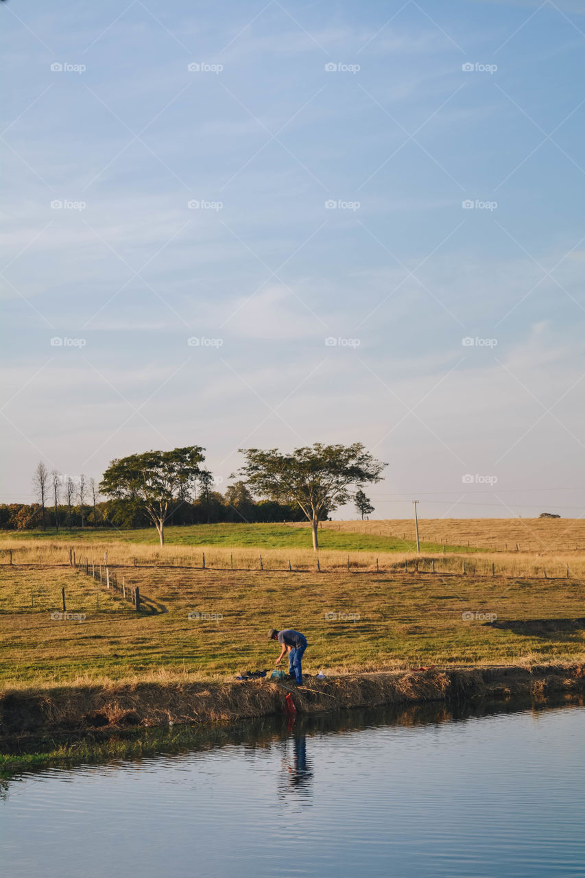 fisherman on a lake
