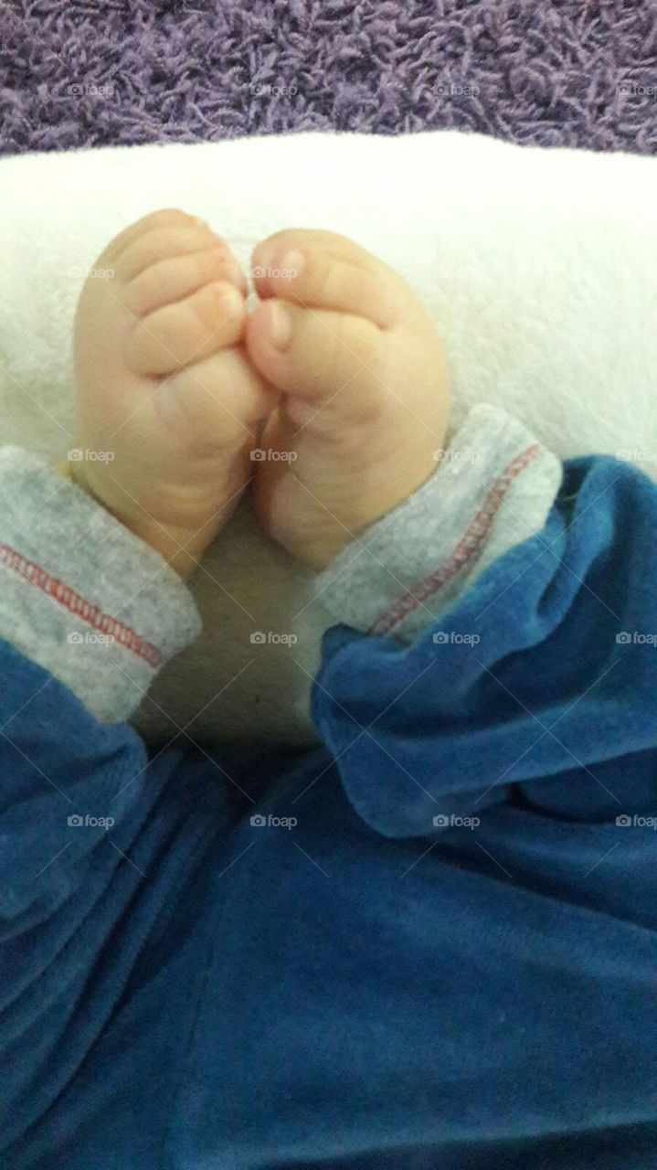 The feet of a small baby