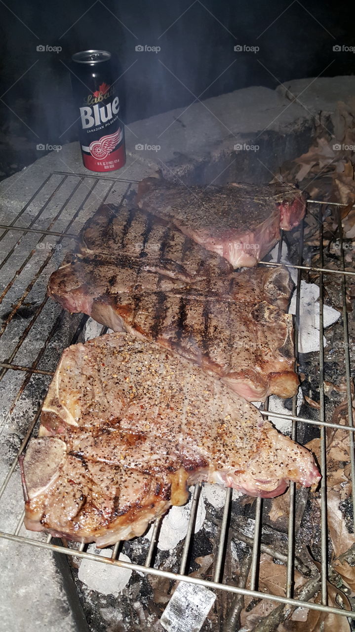 steaks on open fire