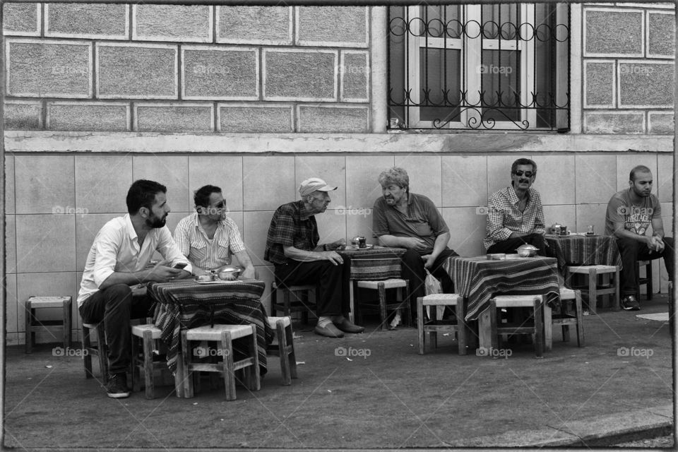 men gathering in a traditional cafe Istanbul Turkey street photography monochrome