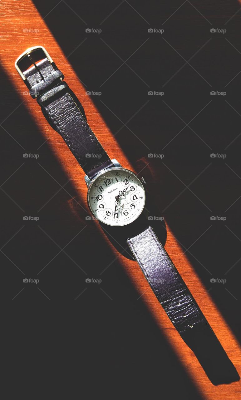 men's soviet watches in the sun on the table