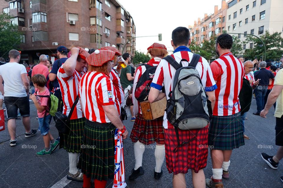 Kilts and Atlético Madrid jerseys after a game in Madrid, Spain 