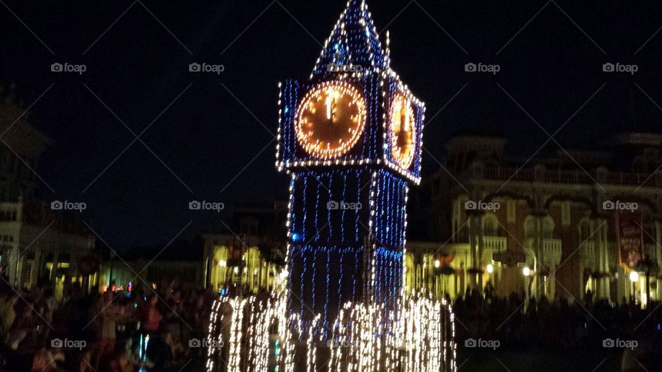 Disney world clock tower . Disney electrical parade