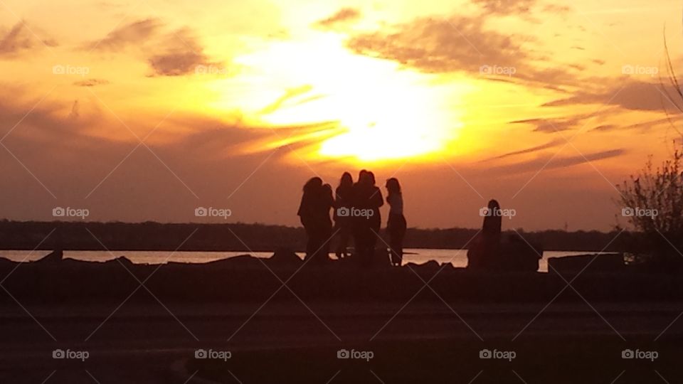 girls enjoying sunset to. girls enjoying sunset to 
