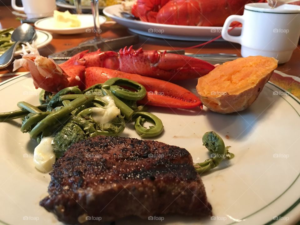 Surf and turf steak and lobster dinner closeup