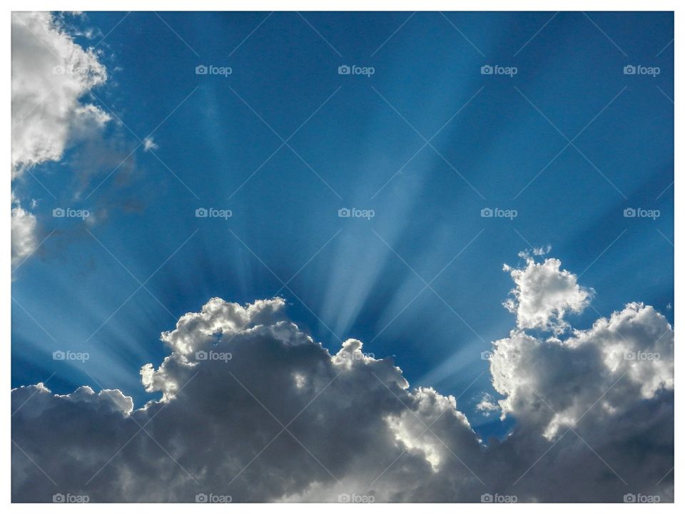 Sun rays on blue sky