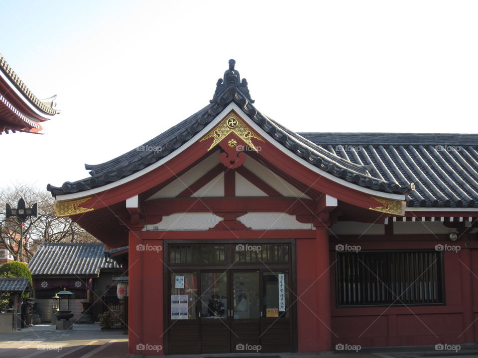 Asakusa Kannon. Sensoji Buddhist Temple and Gardens. Tokyo, Japan. Red and Green Japanese Pagoda