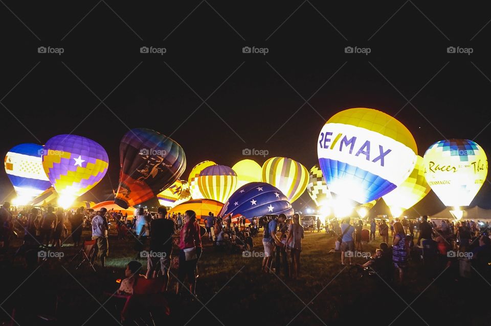 The Balloon Glow at the annual Great Texas Balloon Race, a field of hot air balloons lit up at night