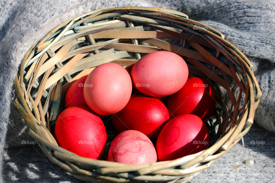 Basket with colorful Easter eggs