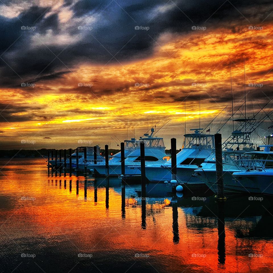 Waiting for my boat ride. the sun setting in the marina caused amazing reflections of the boats