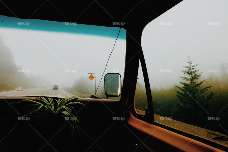 Interior of a car and fog outdoors