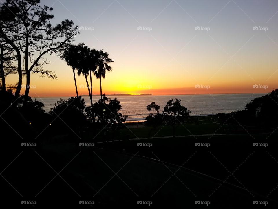 Evening Adios Pacific Coast. Walking towards the beach with my acai bowl treat in hand.Had to abandon my snack to capture the sunset.Laguna Niguel CA