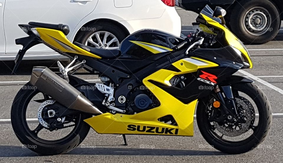 a yellow Suzuki motorcycle