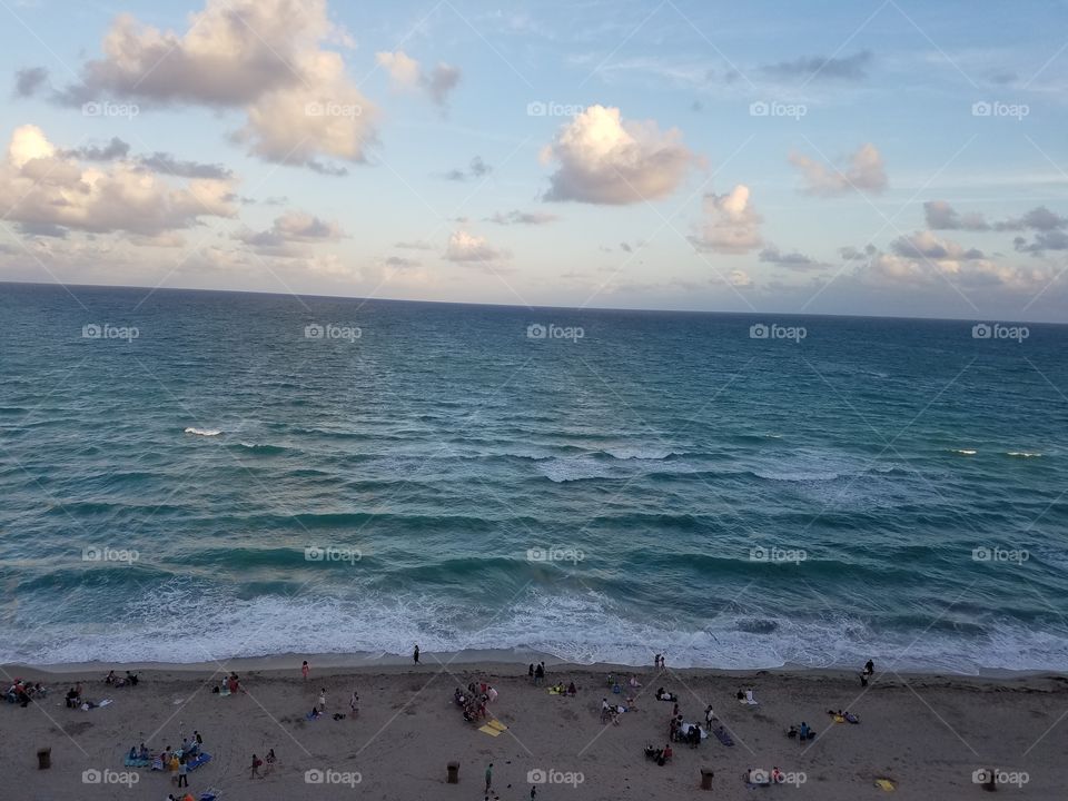 top view of a beach in Miami Florida, United States,  shadows from skyscrapers blanket the beach