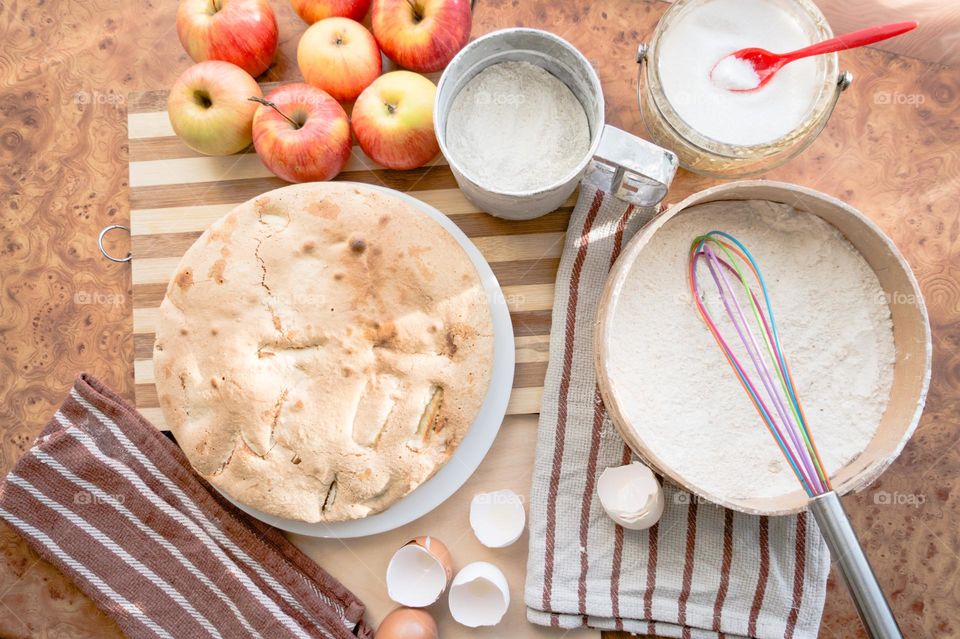 Making homemade puffed apple pie with eggs, sugar and flour.