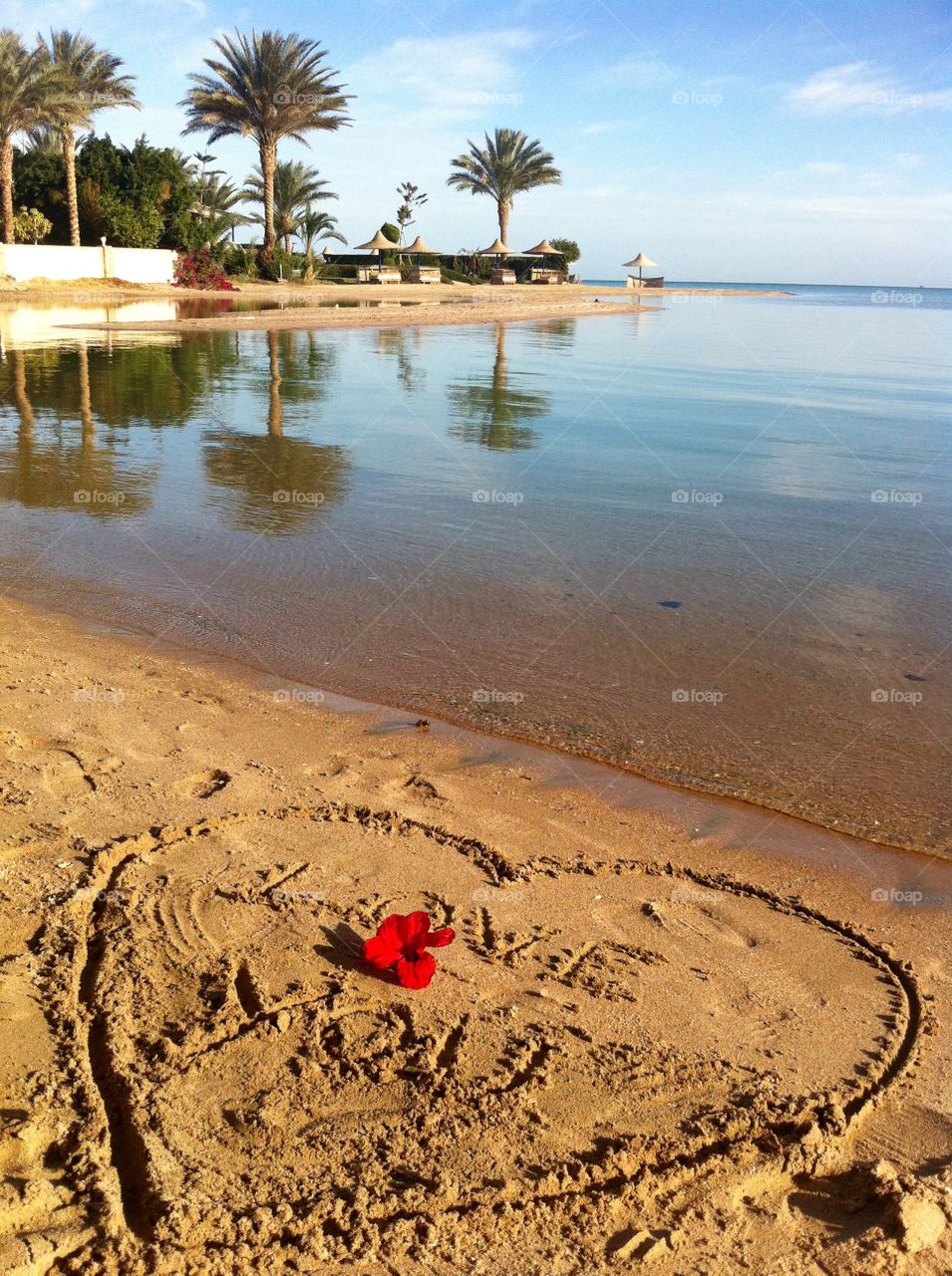 
Love text on sand