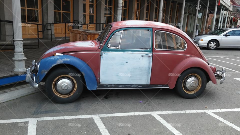 red white and blue Volkswagen Beetle