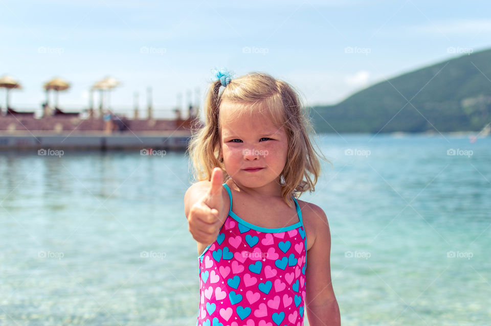 Girl showing thump