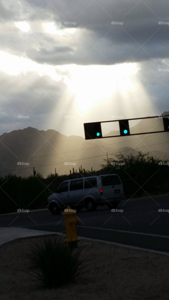 Arizona's sun peeking through the clouds