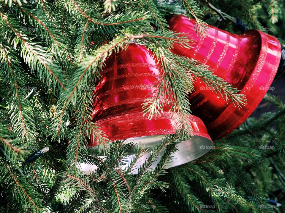 Red bells decorations on a Christmas tree 