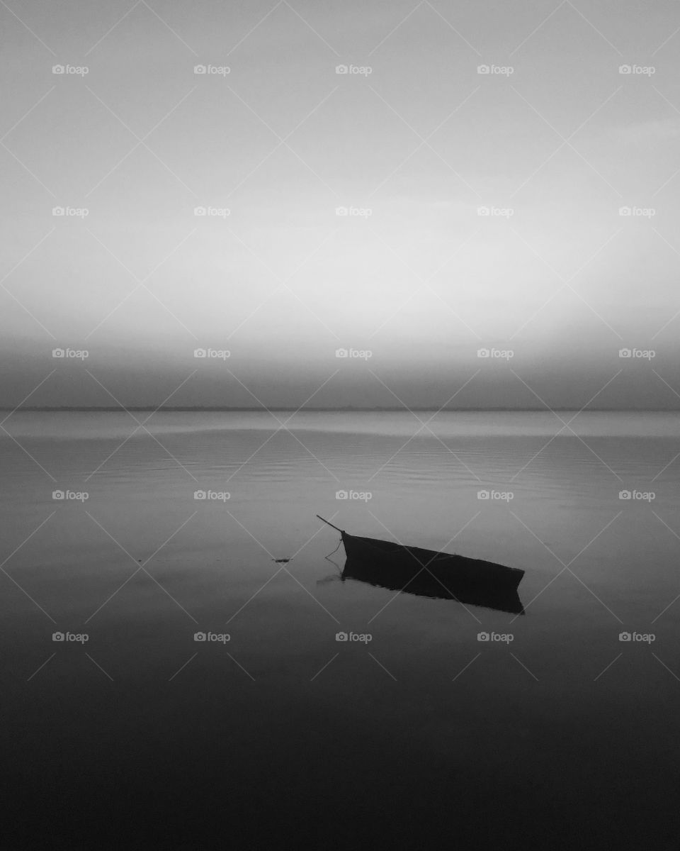 The boat in a lonely see gives the viewers a lonely dark feel and the fact that it is black and white gives it the deepest on how life is not easy on us constantly putting at us lonely place.