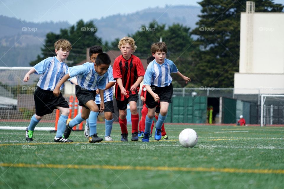 Young Boys Playing On A Sooner Pitch