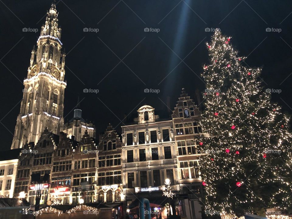 Church and buildings illuminated at night and Christmas decoration 