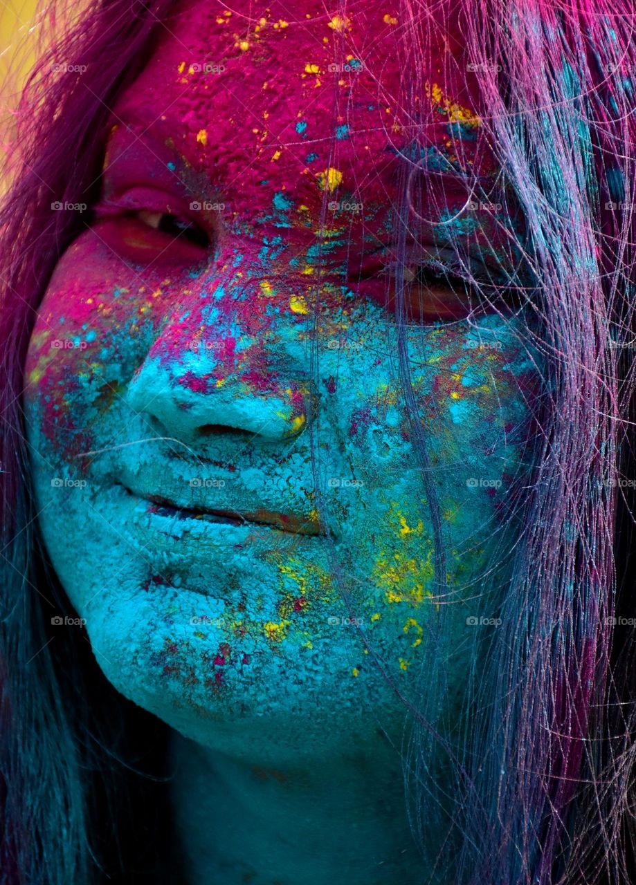 Portrait of a girl with colors on her face during Holi festival