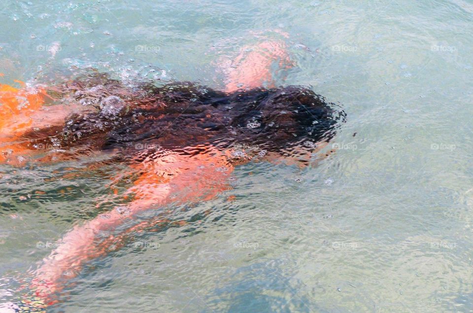 Girl is swimming under Water, Greece