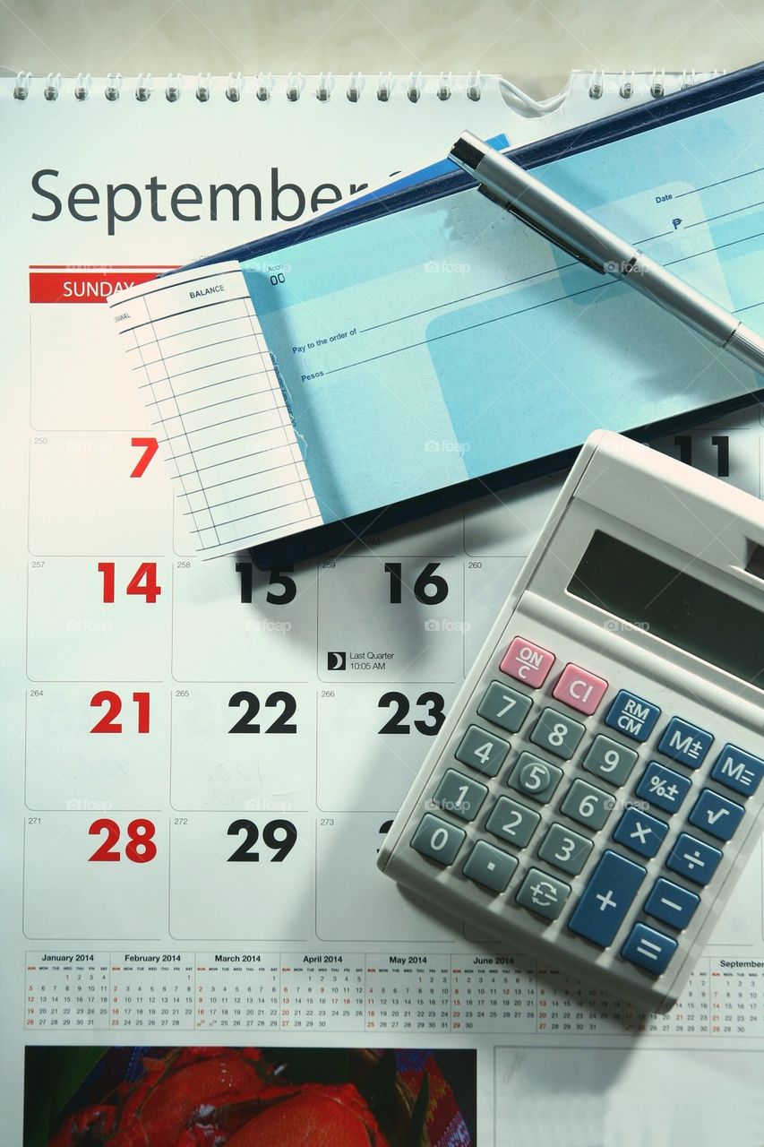 checkbook, calendar and calculator