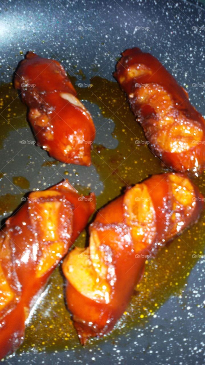 preparing sausages in the kitchen