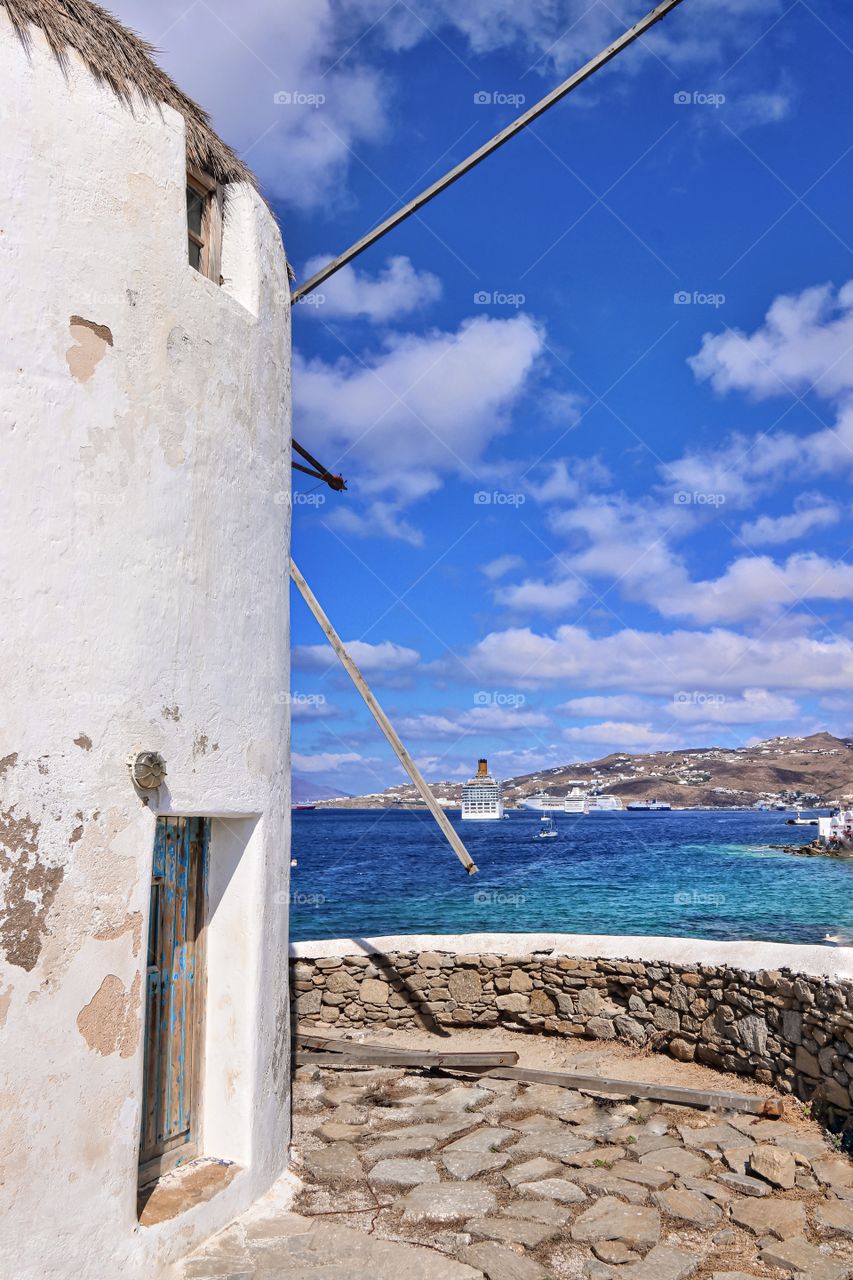 Old white mills on the Greek island of Mykonos