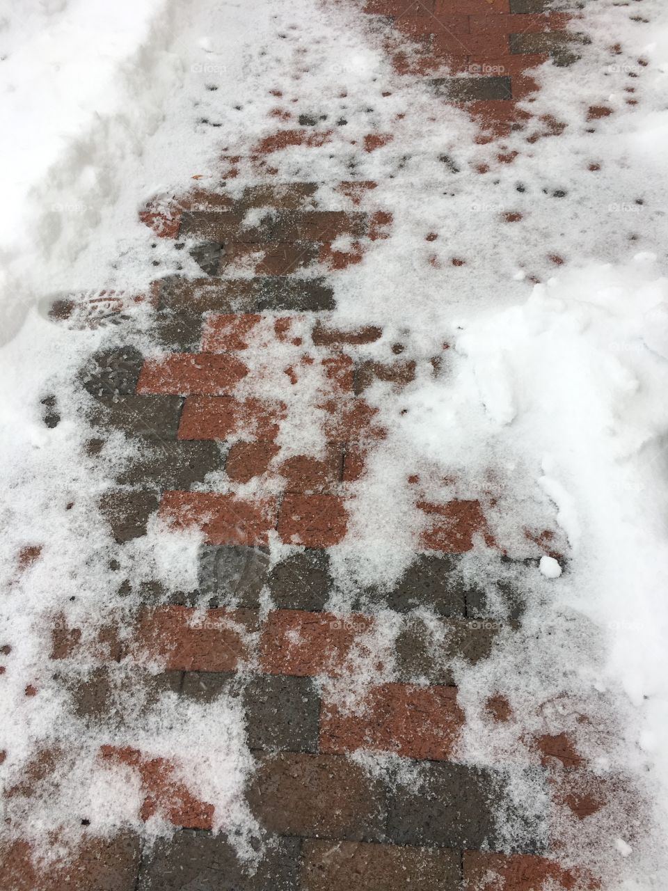 Tread Lightly Ice Snowy Brick Pathway With Footprints