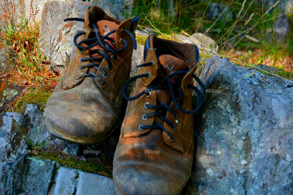 The boots were old. The leather had since cracked and aged. The toes were scuffed and they were falling apart at the seams. The boots had long lived their life of travel,work,joy, and love. After their final journey, it was time to throw them away. It was hard to say GOODBYE!