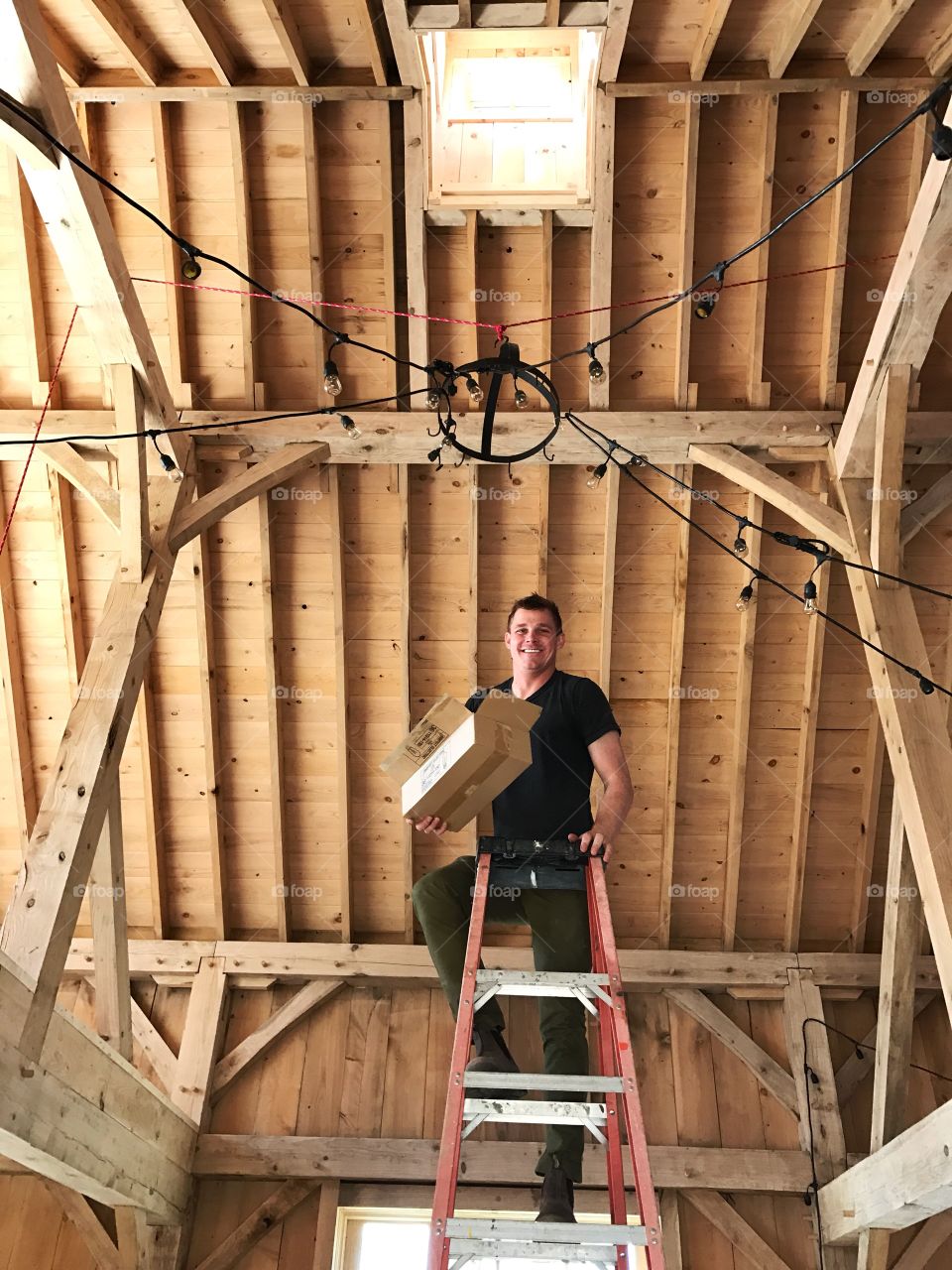 Young man at work in a barn