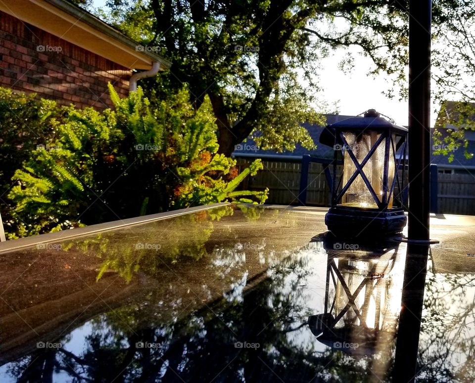 Lantern reflection glass table outside