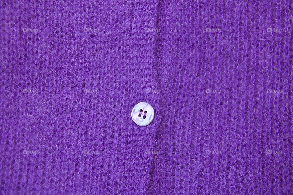 Extreme close-up of a purple cardigan