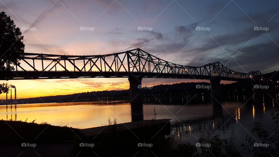 gorgeous sunset on river bridge