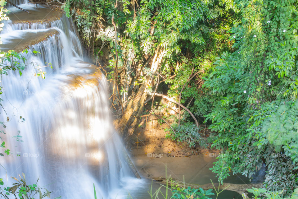 Waterfall flowing from the mountains at Huay Mae khamin waterfall National Park ,Kanchana buri in Thailand.