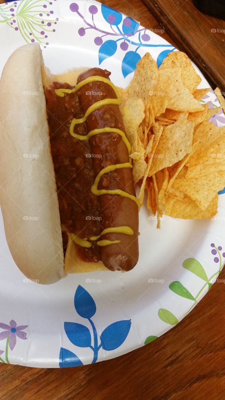 chili cheese hotdog and Baked Lays Barbecue chips