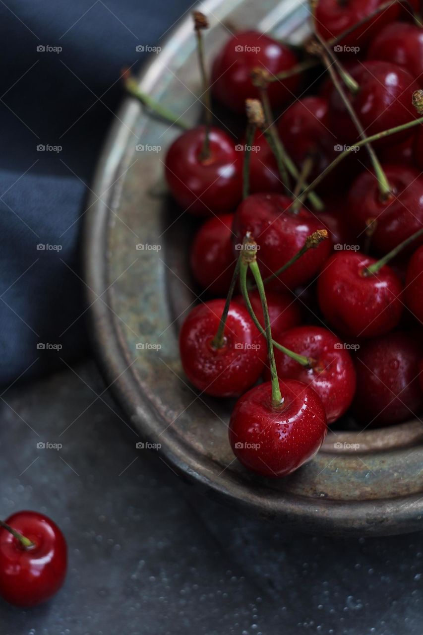 Cherries in a grey plate