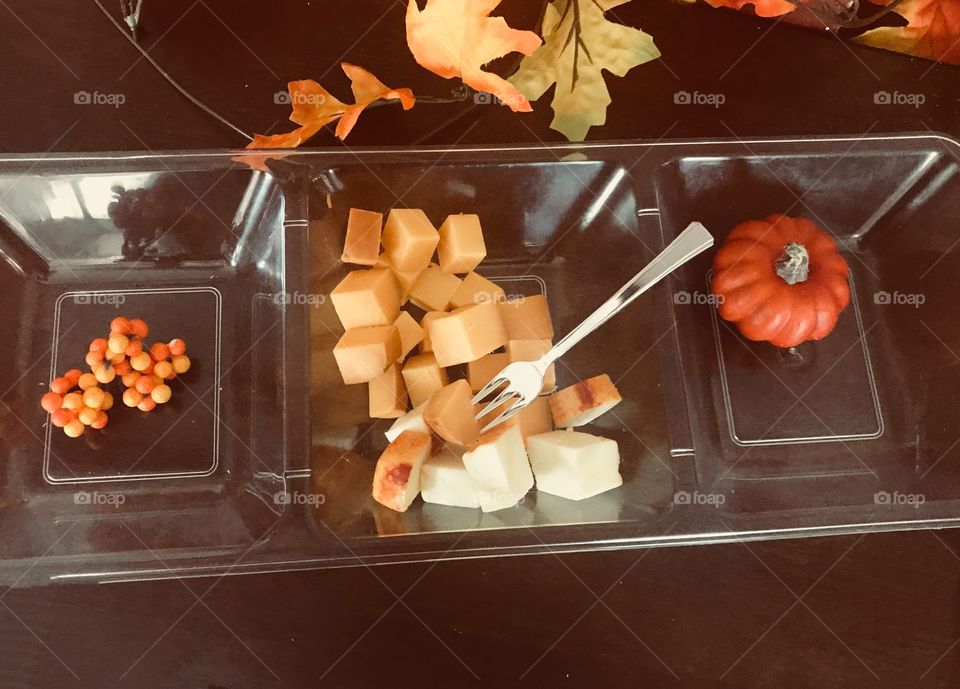 Beautiful Fall Season cheese platter display sitting on a dark wooden table - Halloween, Autumn 