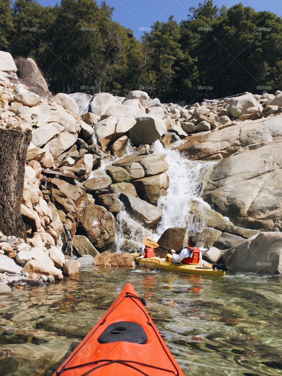 Kayak Near The Waterfall