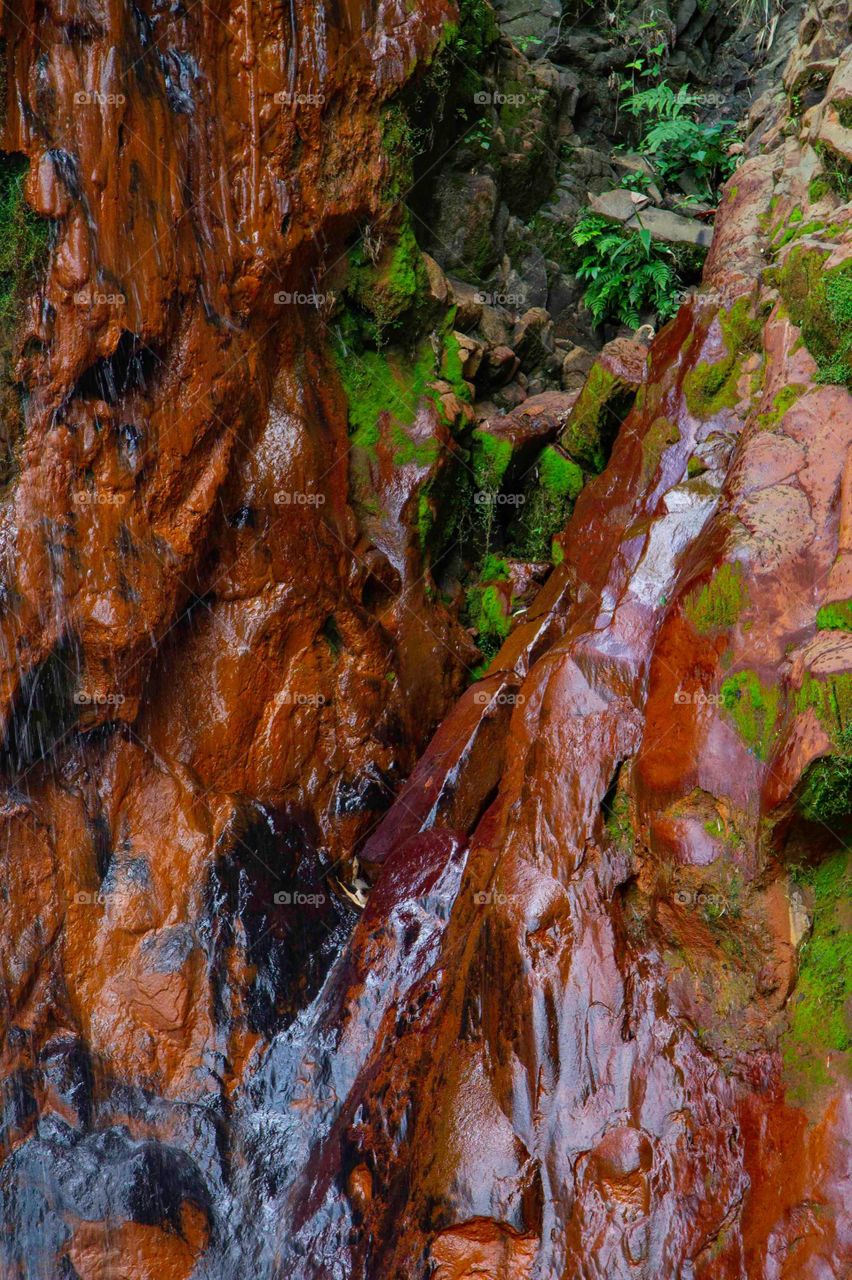 Wet rocks from waterfalls.
