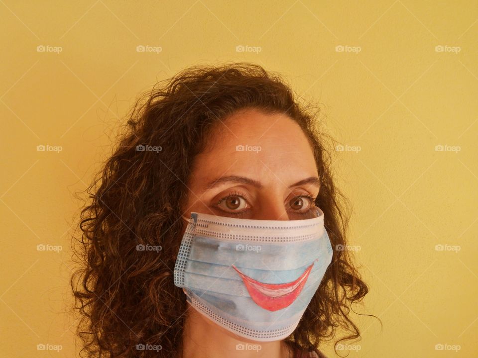 Girl with mask smiles despite coronavirus